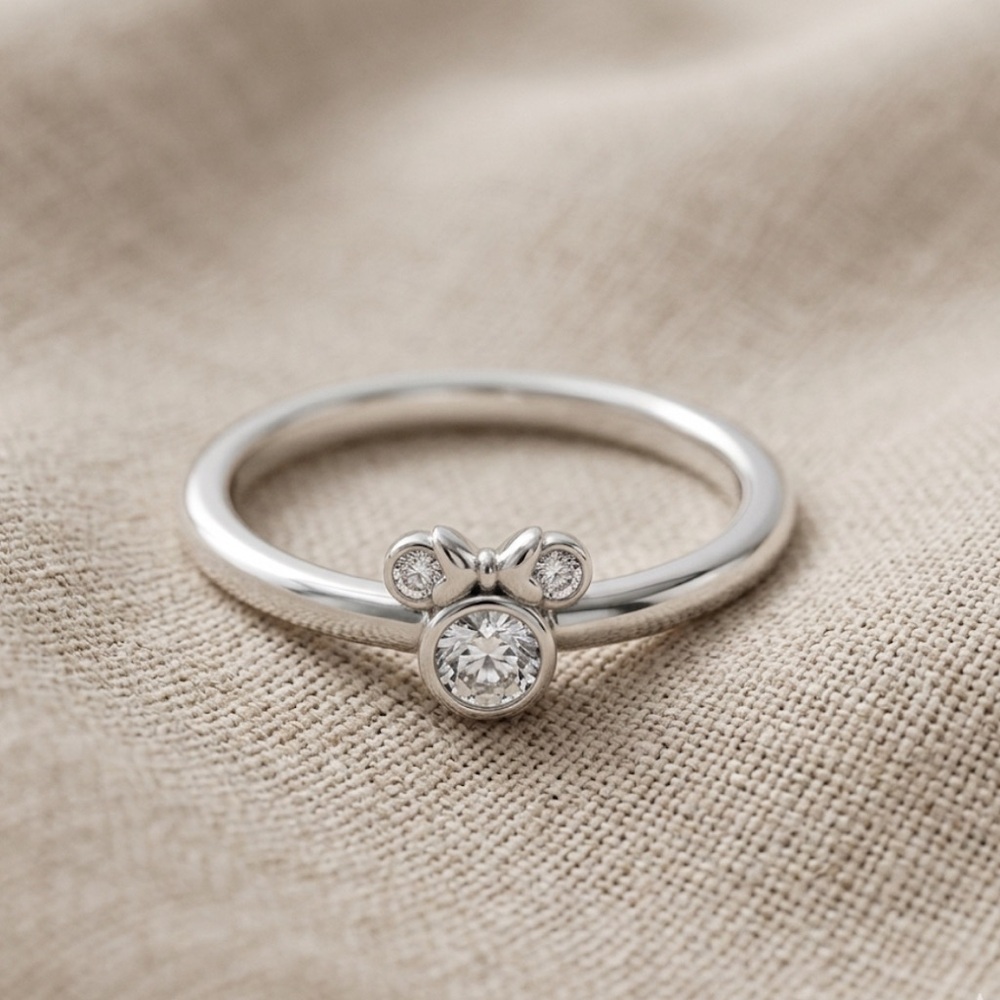 Delicate Silver Bow Accent Ring with Sparkling Stones - Women's Jewelry